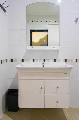 a bathroom with a sink and a mirror at Kathu V pool villa 170 in Kathu