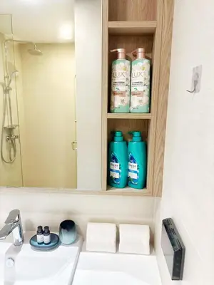 a bathroom with a sink and a mirror at Bangtao Rooftop Seaview Laguna Skypark Condominium in Bang Tao Beach
