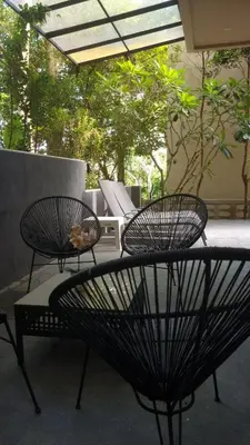 two chairs and a table on a patio at Sparrow Villa - Kamala Beach in Kamala Beach