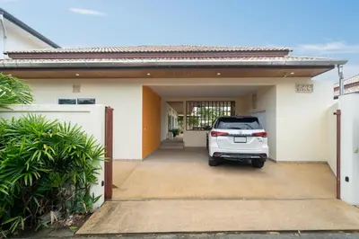 a car parked in the garage of a house at Rawai Beach Villa in Rawai Beach