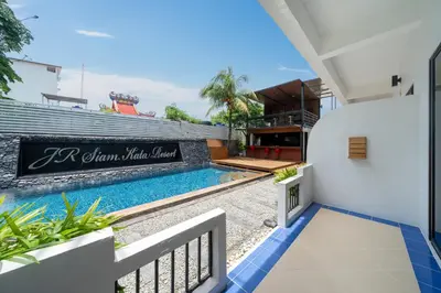 a view of a swimming pool from a house at JR Siam Inn Resort in Kata Beach