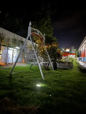 a roller coaster in a yard at night at 3P Phuket Airport Hotel in Phuket