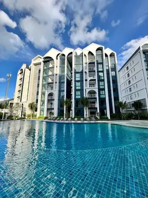 a swimming pool in front of a building at Halo 1 , 2 bedroom, 400m to the see in Nai Yang Beach
