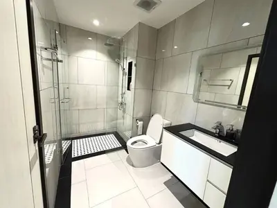 a bathroom with a toilet and a sink and a shower at The Legendary Bang Tao 2-bedrooms apart #402 in Bang Tao Beach