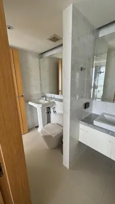 a bathroom with a toilet and a sink and a shower at Aristo 2 Condo with a sea view in Surin Beach