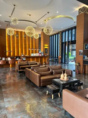 a living room with couches and a table at Kamala City Gate 1 bedroom By Ere P710 in Kamala Beach