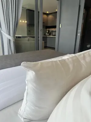a white pillow sitting on top of a bed at Kamala City Gate 1 bedroom By Ere P710 in Kamala Beach