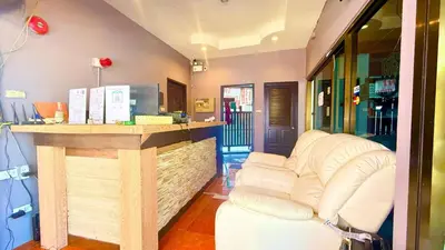 a bar in a store with a white couch at Charming Guest Room in Central Pa Tong, Thailand in Patong Beach