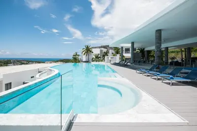 a swimming pool on the roof of a house at The View Phuket By RESAVA in Kata Beach