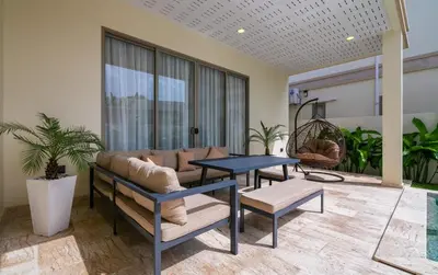 a living room with a couch and a table at Villa Orion at Orbita Villas Rawai in Rawai Beach