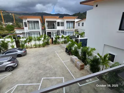 an aerial view of a parking lot in front of a building at Goldena Residence Pool Villas in Kamala Beach