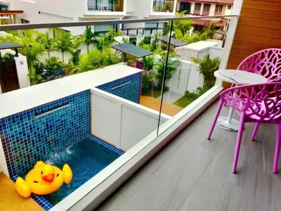 a swimming pool on the balcony of a house at Goldena Residence Pool Villas in Kamala Beach