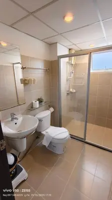 a bathroom with a toilet and a sink and a shower at No 498 SPD in Phuket Town