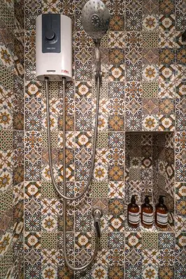 a shower in a bathroom with tiles on the wall at 1BR Designer Mountain View Condo - Central Phuket in Phuket Town