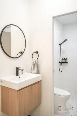a bathroom with a sink and a mirror at Stylish 3 Bedroom Villa with Garden, Chalong - by PoshSaga in Chalong