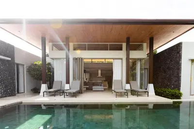 a villa with a swimming pool and a house at Botanica Foresta x MonthStayZ Thailand in Bang Tao Beach