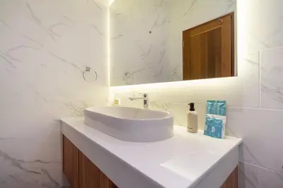 a white bathroom with a sink and a mirror at Nicky Villa Luxury Private Haven in BangTao Laguna in Laguna Phuket