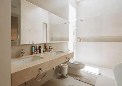 a white bathroom with a sink and a toilet at Вилла в поселке БанБуа in Rawai Beach