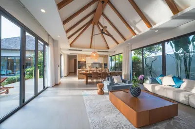 a living room with a couch and a table at BangTao Luxury 5 Bedroom 1200sqm Modern Bali Style Holiday Villa Quiet and Private Large Private Pool Large Garden in Bang Tao Beach