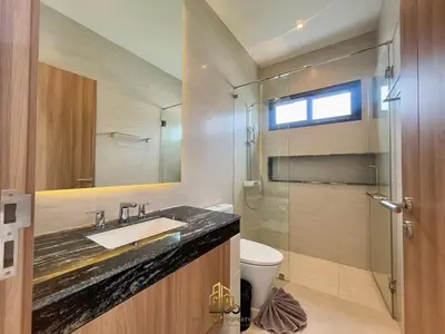 a bathroom with a sink and a toilet and a shower at 4 Br Pool Villa in Chalong in Phuket Town