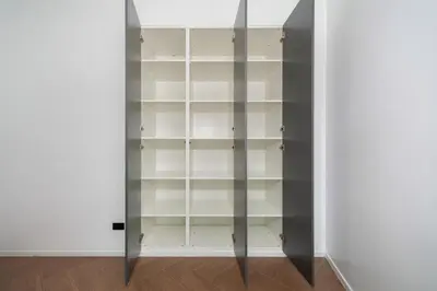 a closet with glass shelves in a room at Villa Heaven in Kata Beach