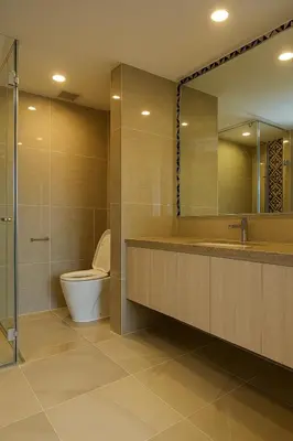 a bathroom with a toilet and a sink and a mirror at The Ozone Condominium 2 bedroom by Search Estate in Phuket Town