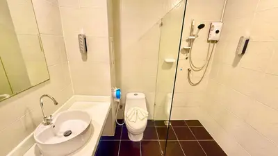a bathroom with a sink and a toilet and a shower at Abdullah Residence in Patong Beach