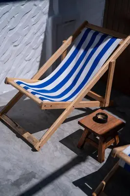 a blue and white beach chair with ainylinylinylinylinylinylinylinyl at Sweett Lemon Home in Patong Beach