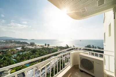 a balcony with a view of the ocean at Waterfront 16D seaview 2 BR apartment - 5 min walk to Karon beach in Karon Beach