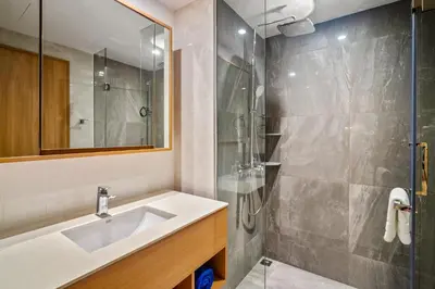 a bathroom with a sink and a shower at Laguna Beachside Block 2 by Banyan Living in Bang Tao Beach