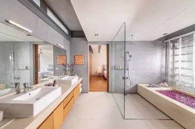 a bathroom with two sinks and a shower at Villa Cielo in Ban Han Pa To