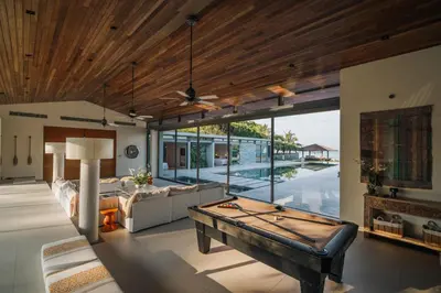 a living room with a pool table in it at Villa Essenza in Ban Han Pa To