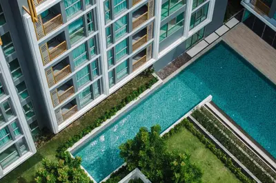 an overhead view of an apartment building with a swimming pool at 1 Bedroom 108-114 Pool View at Ozone Laguna near Bangtao Beach and Golf in Bang Tao Beach