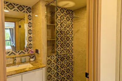 a bathroom with a sink and a mirror at 1 Bedroom 108-114 Pool View at Ozone Laguna near Bangtao Beach and Golf in Bang Tao Beach