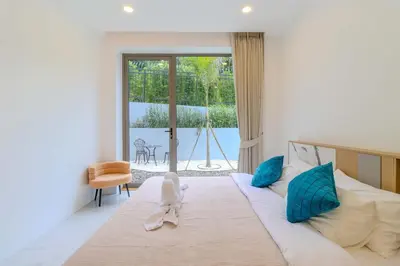 a bedroom with a large bed and a large window at V255 Huge Brand-New 7BR Pool Villa Rooftop View in Kata Beach