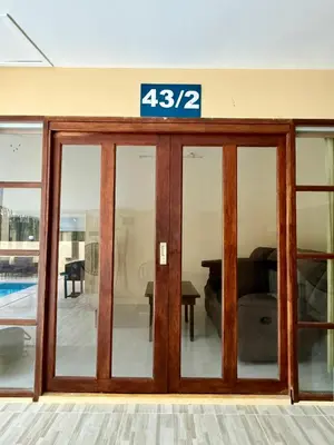 a glass door with a sign on top of it at The glade in Ko Yao Noi
