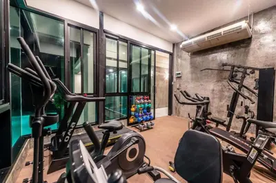 a gym with several exercise bikes in a room at Seaview 1 BR Apt at VV Patong C301 near Freedom Beach in Patong Beach