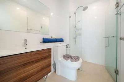 a bathroom with a toilet and a sink and a shower at Seaview 1 BR Apt at VV Patong C301 near Freedom Beach in Patong Beach