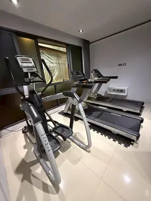 a gym with two treadmills and a treadmill at Emerald Terrace Resort 622 in Patong Beach