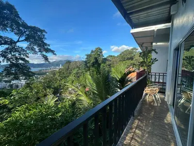 a balcony with a view of the mountains at Maison Paradise Sea View in Patong Beach