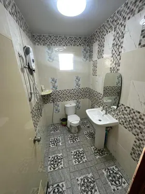 a bathroom with a toilet and a sink at Maison Paradise Sea View in Patong Beach