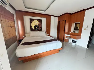 a bedroom with a large bed in a room at Soul House Patong in Patong Beach