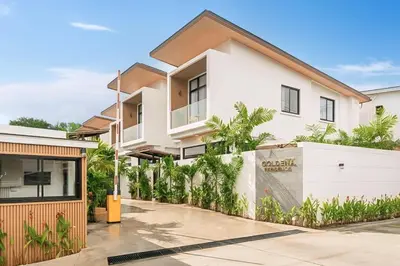 a white house with a fence in front of it at Villa Serana - New Private Pool Villa in Goldena Residence, Kamala in Kamala Beach