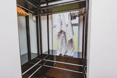 a room with a display case with clothes in it at Luxury Angsana Residence in Bang Tao Beach