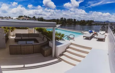 a swimming pool on the deck of a house at Luxury Angsana Residence in Bang Tao Beach