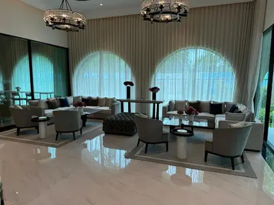 a lobby with couches and tables and windows at Апартаменты у океана пляж Бангтао Title Legendary Bangtao in Bang Tao Beach