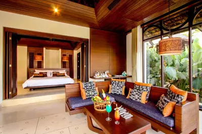 a living room with a couch and a bed at The Vijitt - Two Bedroom Pool Villa in Ban Saiyuan (1)