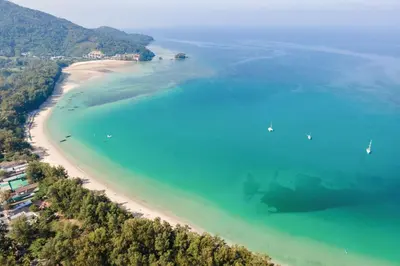 an aerial view of a beach with boats in the water at Dewa Villa in Nai Yang Beach