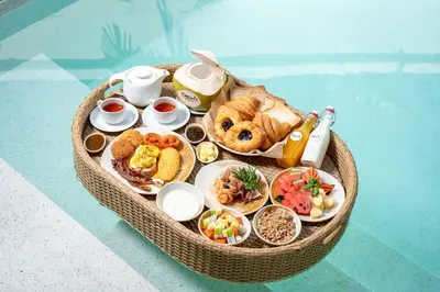a miniature table of food in a basket at Naiyang Villa in Nai Yang Beach