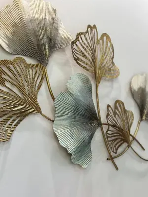 a group of three metal leaves on a table at Cozy villa - perfect place to stay in Phuket in Ban Saiyuan (1)